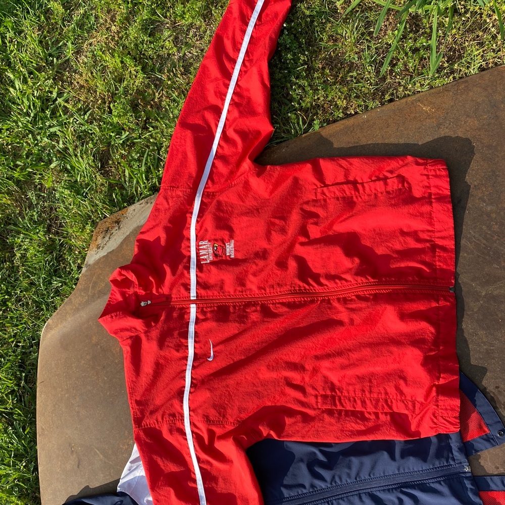 Nike’s red windbreaker